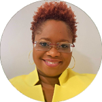 Portrait photo of woman in yellow top smiling, in a circe