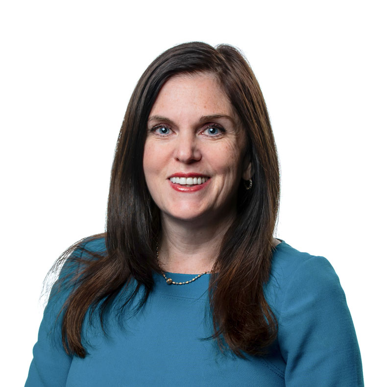 photo of woman with brown hair and blue shirt