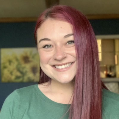 Portrait photo of Rachael Bottone, smililng wearing a green top