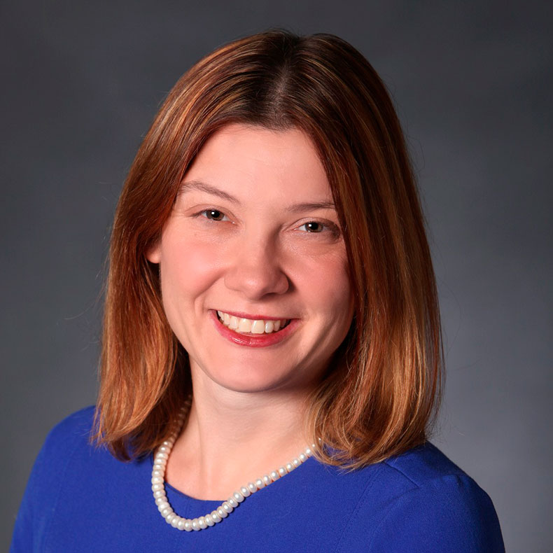 Portrait photo of woman in blue top