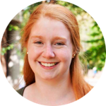 Woman with red hair, smiling, inside a circle
