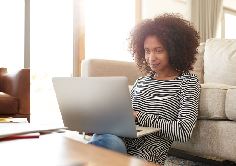 woman on laptop in home