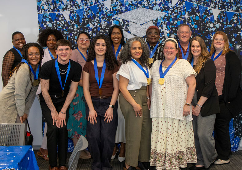 Career Outlook group of young adults in front of decorative blue banner