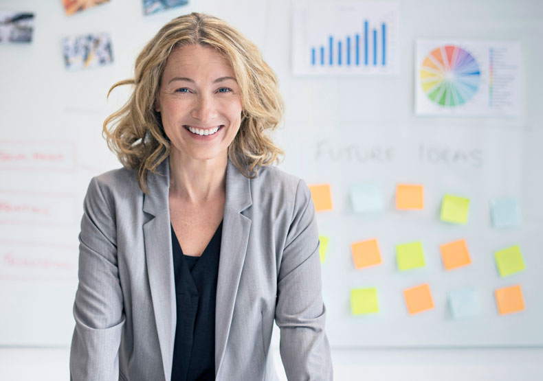 Smiling white female with arms post it notes