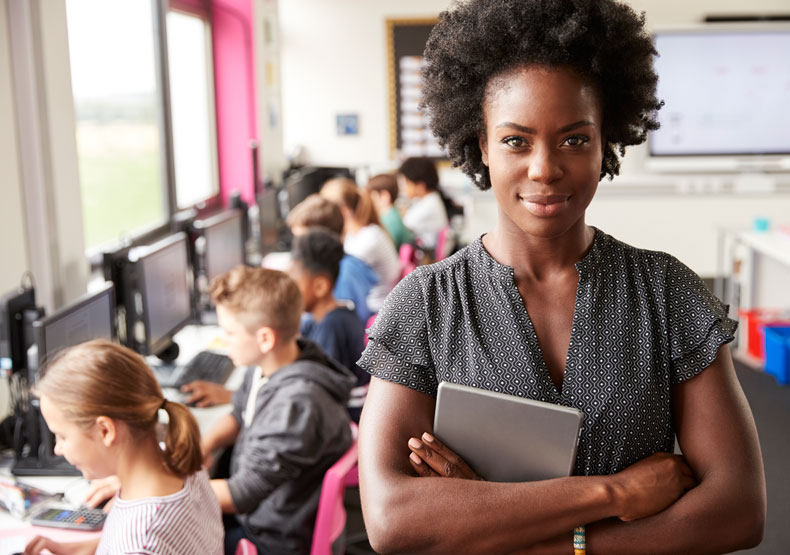 female teacher in front of class of students