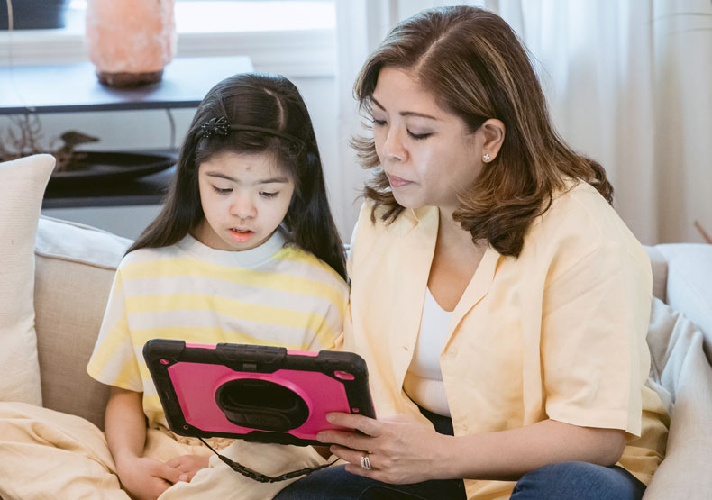 woman working with young girl