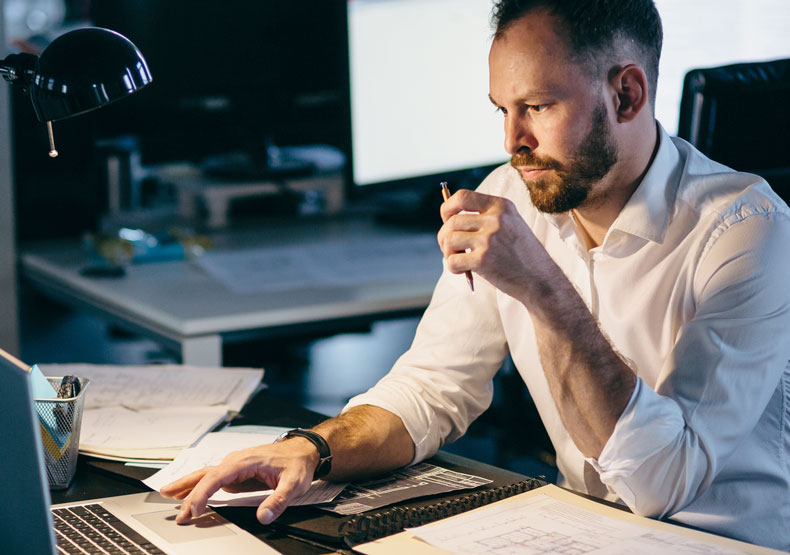 Male at desk at night