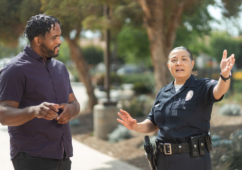 Police officer assists a citizen