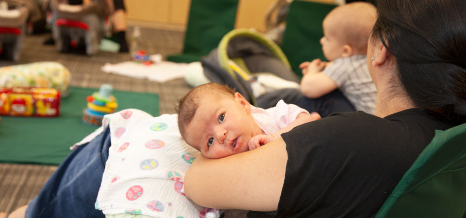 new mom with her first baby at a support group