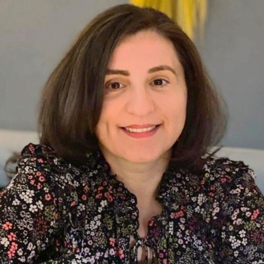 profile photo of woman in brown hair and flowered top