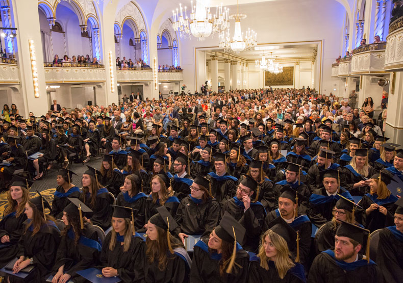 photo of large ballroom filled with graduate students