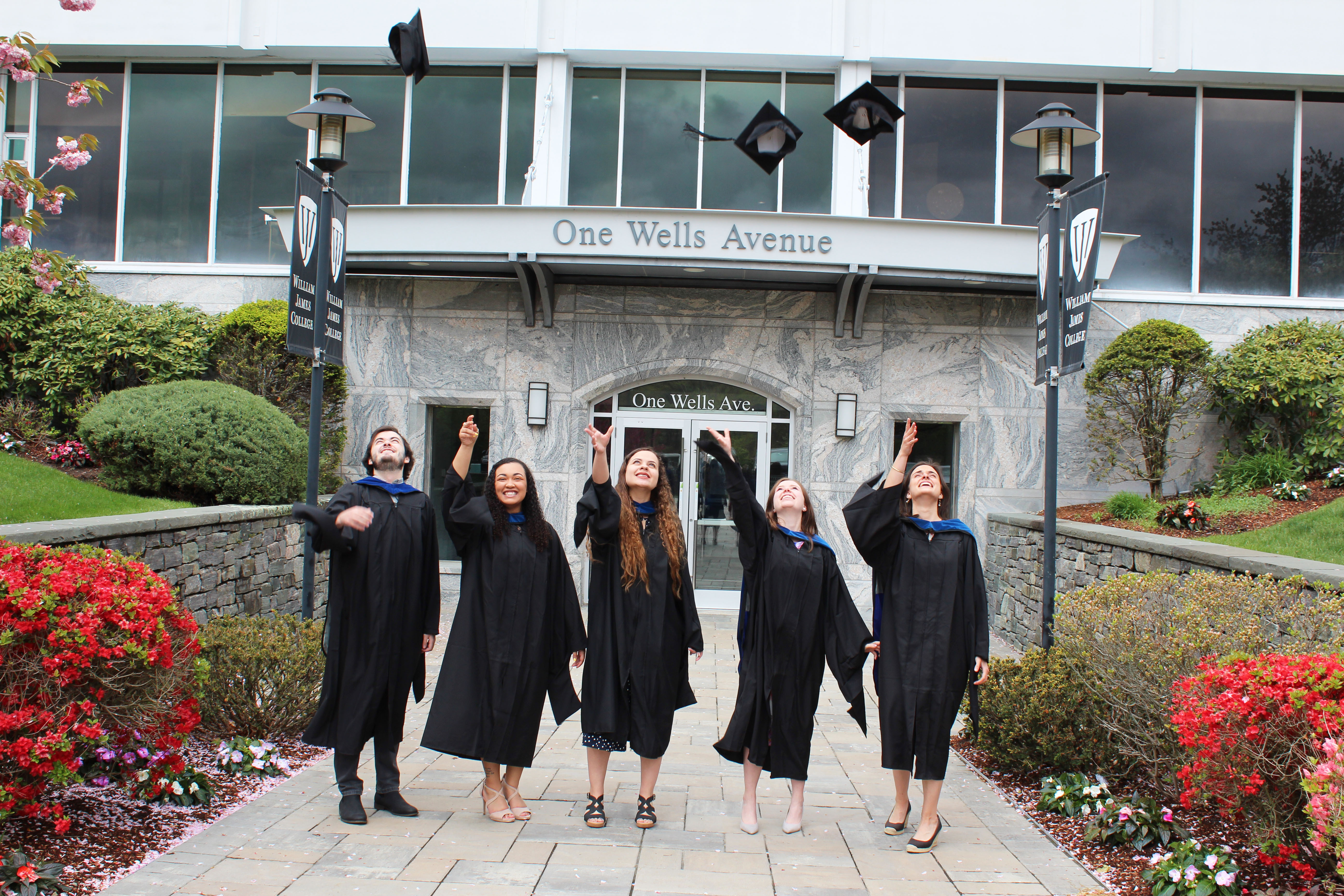 William James College 2021 Graduates Toss Hats In the Air
