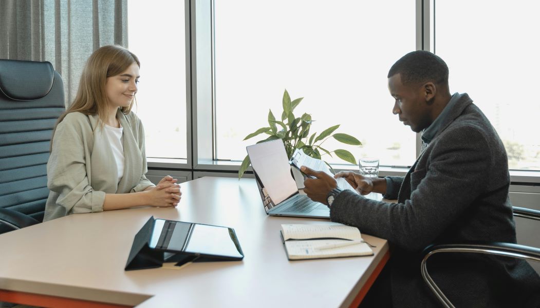 Man interviewing a young woman