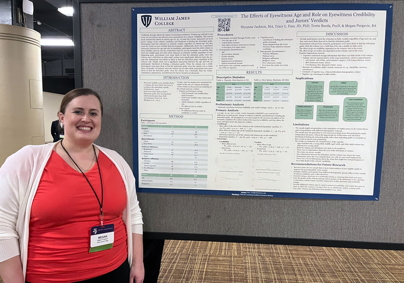 Woman standing in front of conference poster