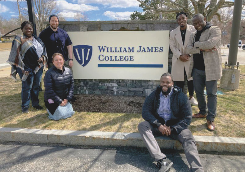 group of students in front of william james college sign