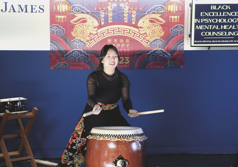 woman playing drum