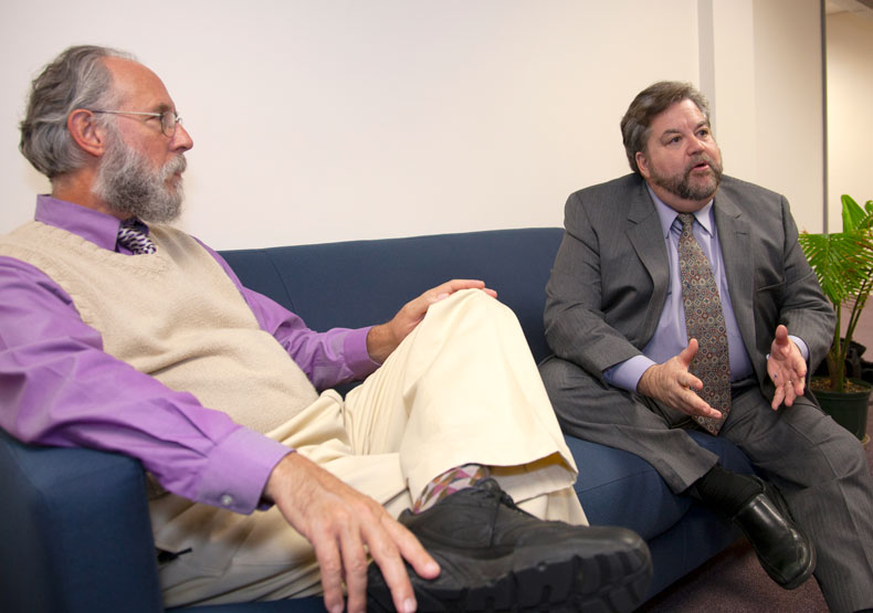 two men sitting together