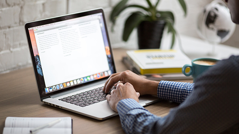 How to Ask for a Letter of Recommendation Hands at laptop on table