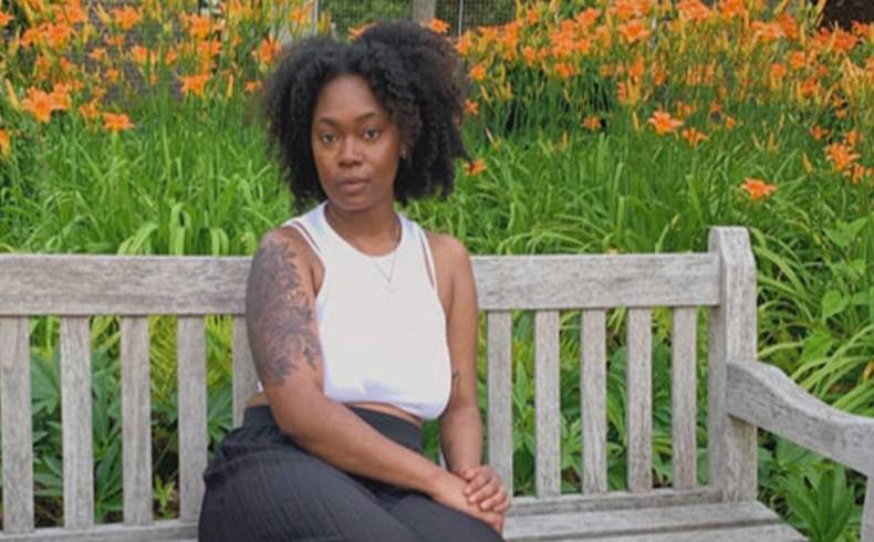 Olivia Fenty sitting on a bench