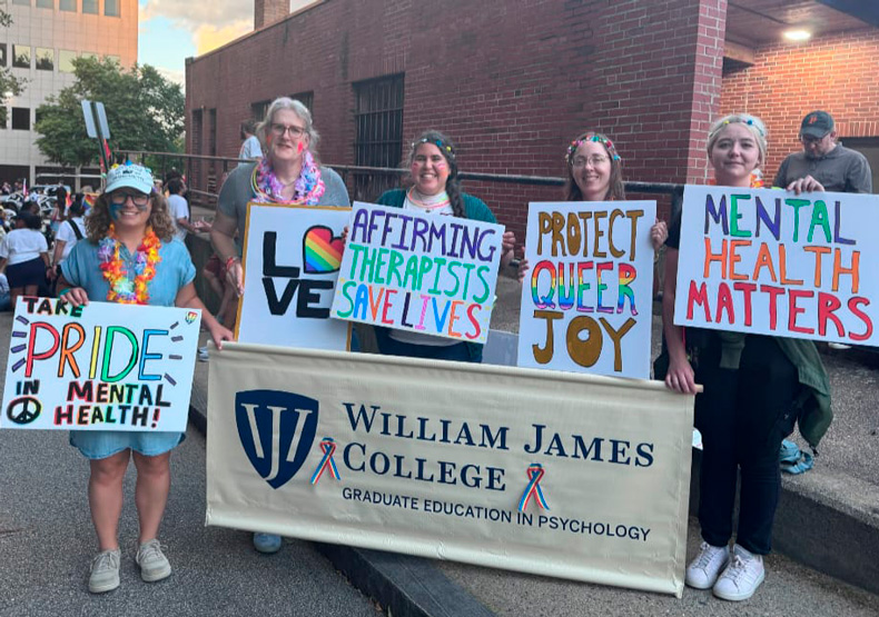 group of people in front of a sign