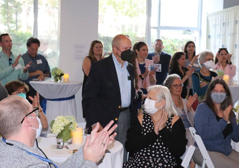 Audience applauding the retiring faculty members.