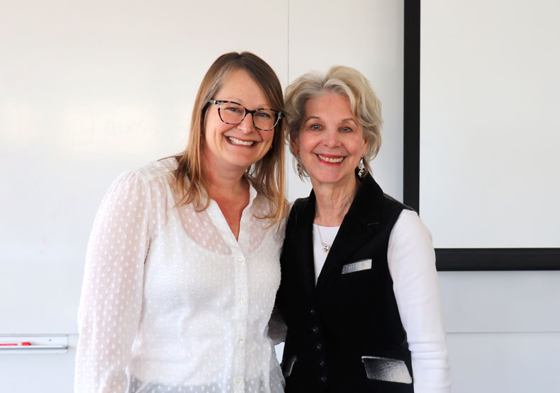 Two woman smiling at camera