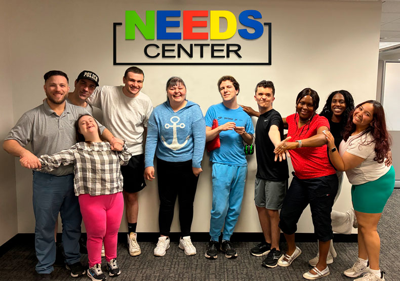 group of people in front of sign