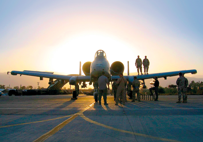 photo of air force jet silhouetted by the sun