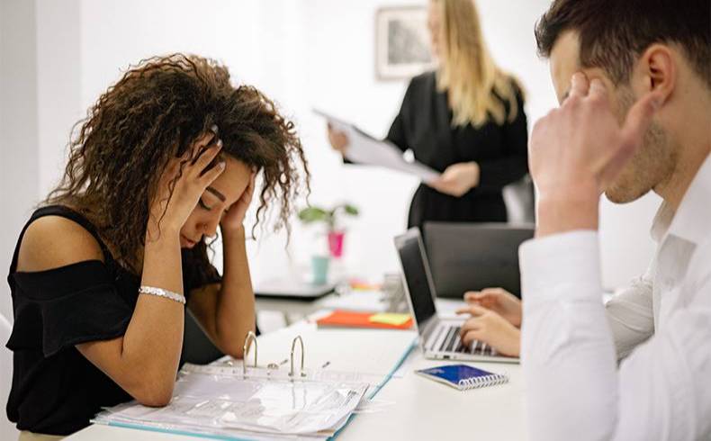 Woman stressed in office