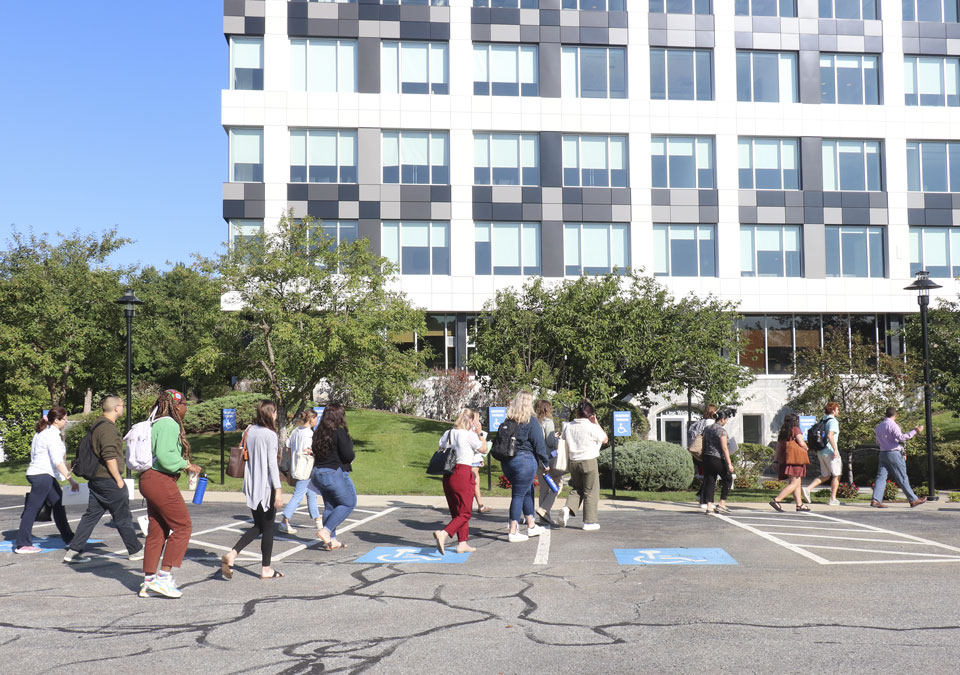 students walking in front of building